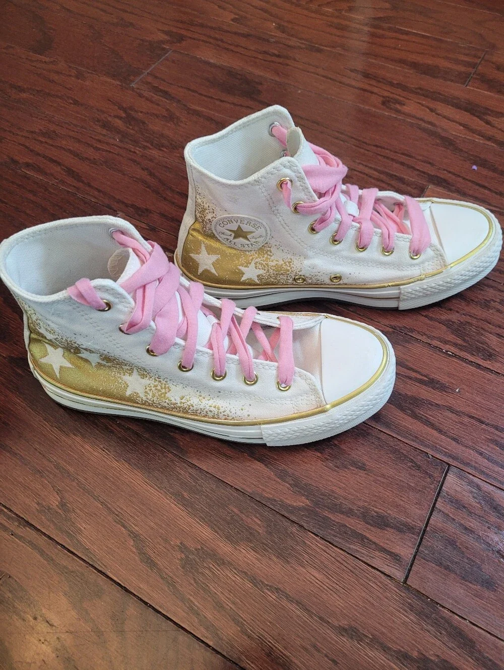 White High-Top Converse Chuck Taylor Sneakers with Pink Laces